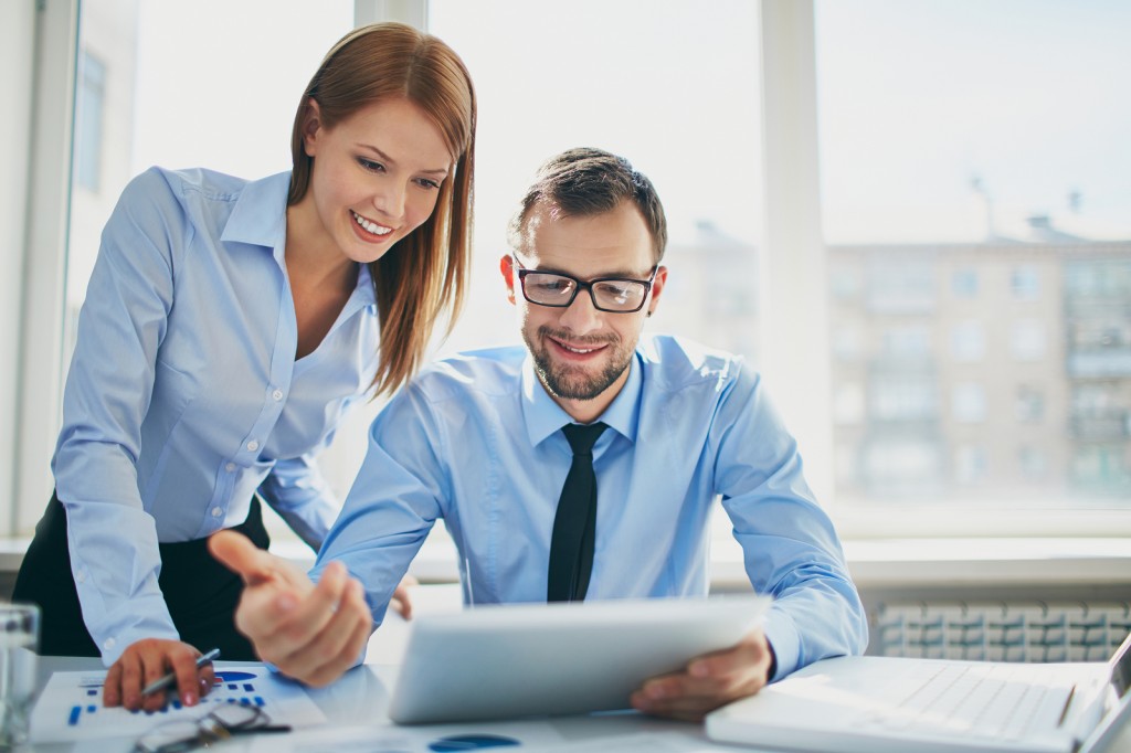 Two successful business partners working at meeting